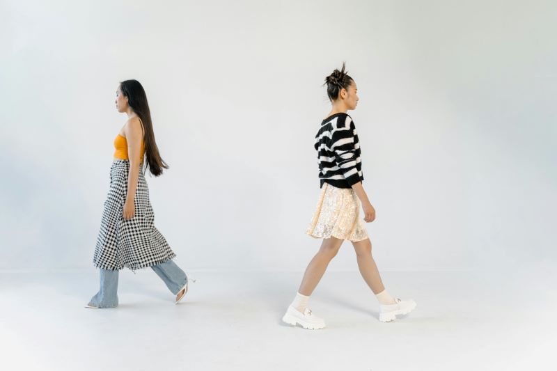 Beginner model in the UK practicing a confident runway walk in a fitted bodysuit with strong posture and poise.