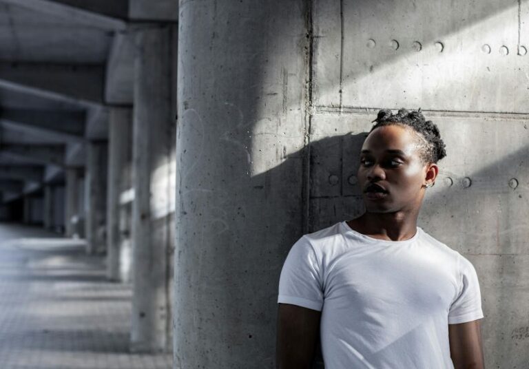 UK model taking a quiet moment backstage, reflecting on mental health and balance in a competitive modelling industry.