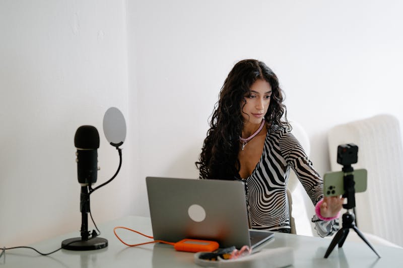 Professional UK model reviewing privacy settings on a smartphone to maintain a safe and polished online presence.